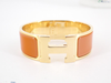 Secondhand Hermès Clic H Orange Metal Jewelry