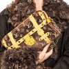 Fashionable brown and yellow Louis Vuitton bag held by a model with curly fur coat - HerAge