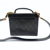 Chanel quilted cosmetic bag in black leather and gold chain