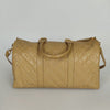 Chanel quilted travel bag in beige patent leather