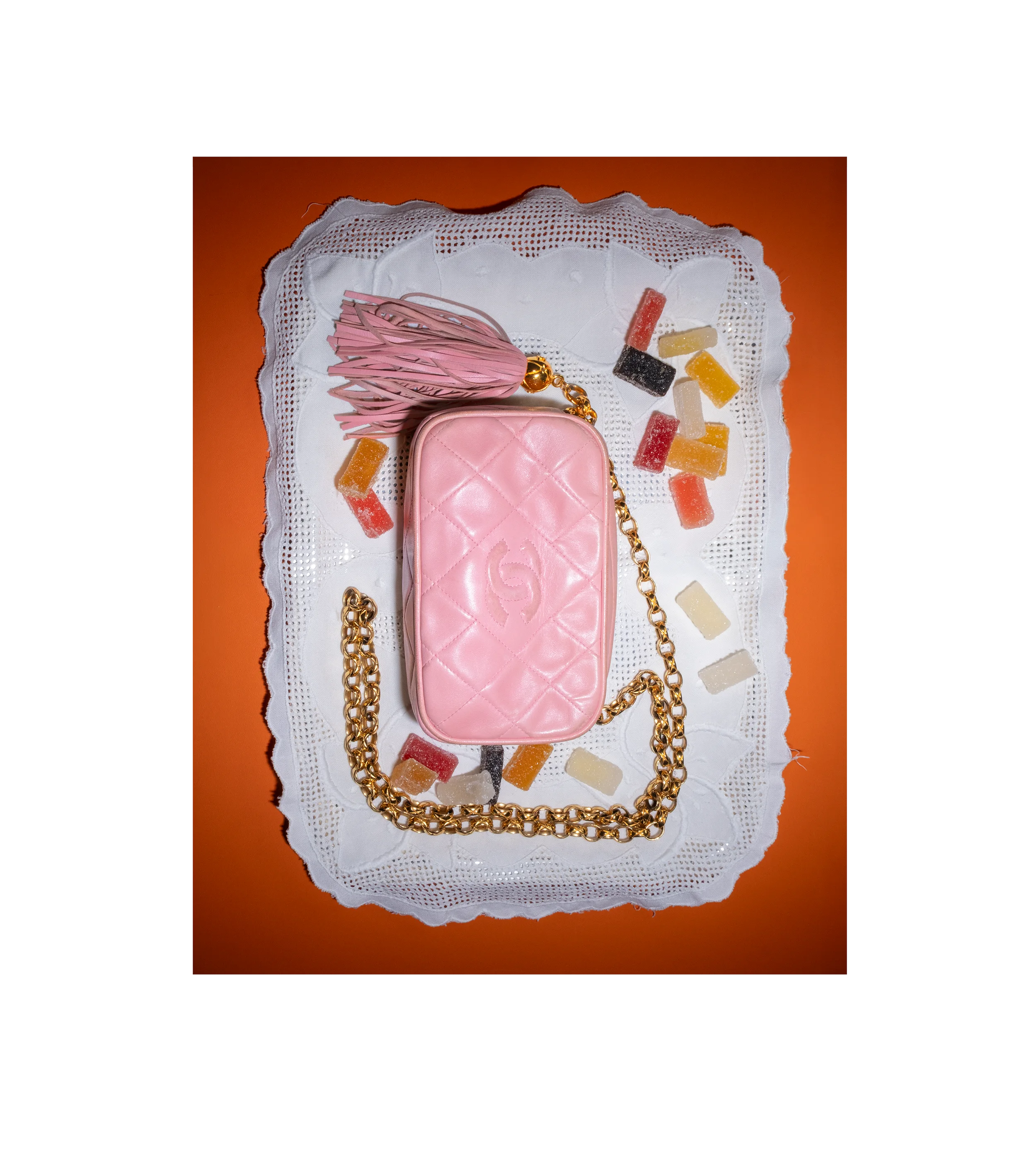 Shop authenticated vintage Chanel pink quilted camera bag with gold chain, curated by Her-Age, luxury resale marketplace in Italy.