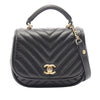 Chanel Mini Reverse Quilted Chevron Lambskin Round Satchel Secondhand