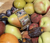 Vintage gemstone bracelet styled with fresh fruit in a Her-Age editorial setting
