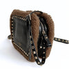 Valentino Garavani Rockstud shearling shoulder bag in black patent leather